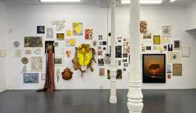 Wall showing a selection of finished and unfinished pieces, sketches, artist references, stencils, paint and mesh tests, dead ends, possibilities, photos of earlier work printed on mesh, vintage needlepoint, grids, and cloud forms_Six years of work leading to the Meshworks in paint and mesh_See below for description